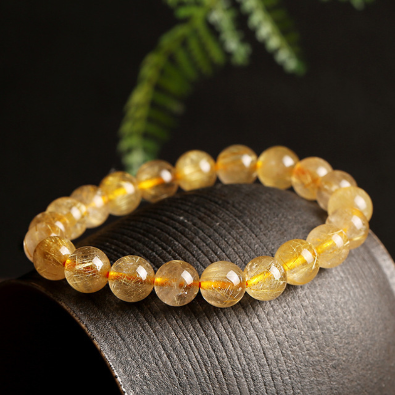 La pulsera de cristal de titanio "Purificación dorada"