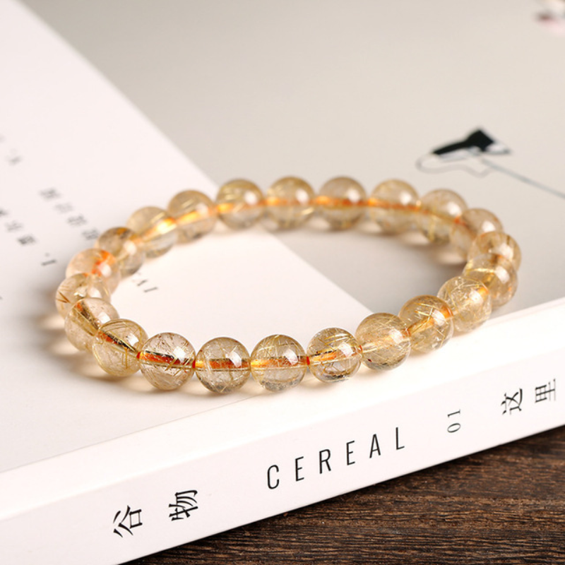 La pulsera de cristal de titanio "Purificación dorada"