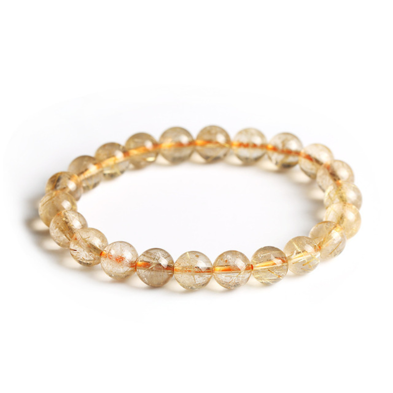 La pulsera de cristal de titanio "Purificación dorada"